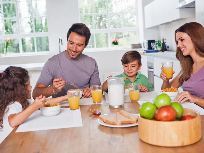 Family-Having-Breakfast-In-The-Kitchen